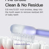 A fine bristle baby toothbrush is shown cleaning a baby tooth, highlighting its small bristles and design.