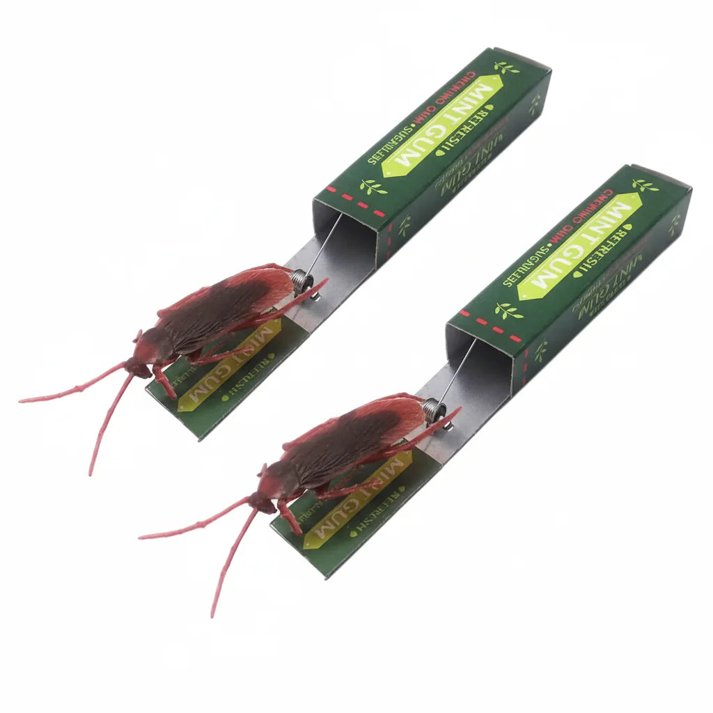 A pair of realistic cockroach prank gum toys with red bodies and green packaging.