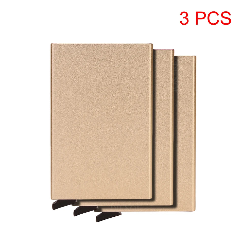 Three slim metal RFID blocking card holders with a pop-up design shown side by side.