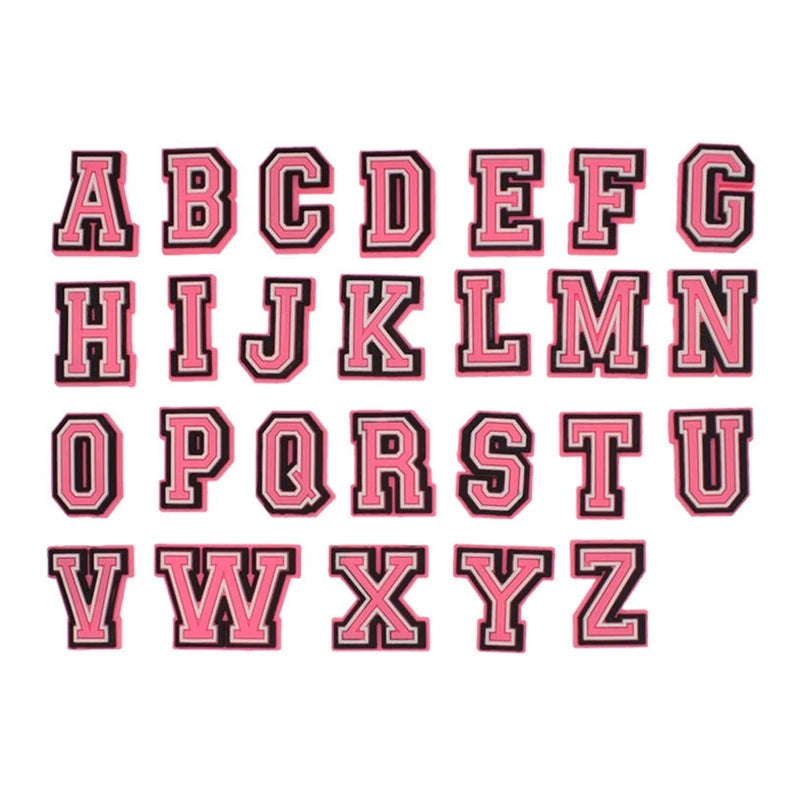 A set of pink and black PVC alphabet pins for decorating shoes, sandals, and clogs.