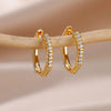 Boucles d'oreilles créoles en zircon cubique ton or