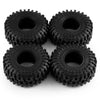 A pack of four black mud terrain rubber tires for RC crawlers.