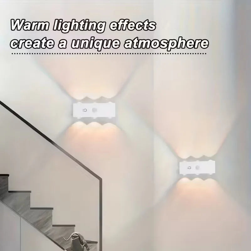 A modern interior shows warm lighting effects from a smart motion-sensor LED wall light illuminating a staircase area.