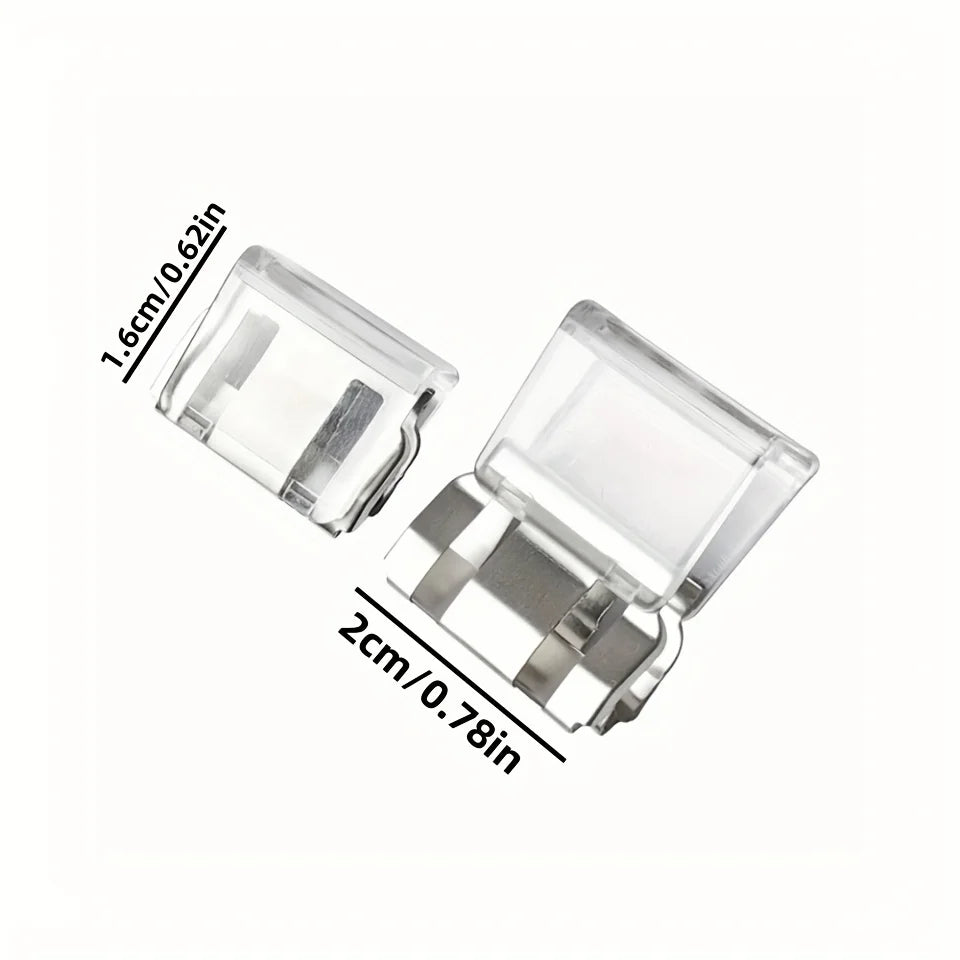 Clear plastic pant hem clips with silver metal grips for keeping trousers off the floor