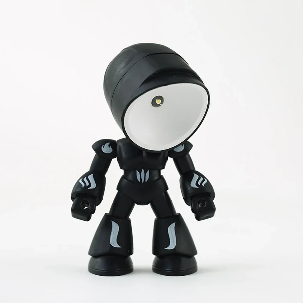 A black bendable robot night light with a round, illuminated head and glowing accents.