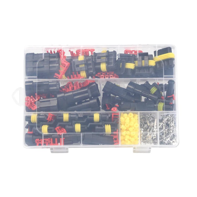 A clear plastic container holding a kit of waterproof automotive electrical connectors with male and female terminals.