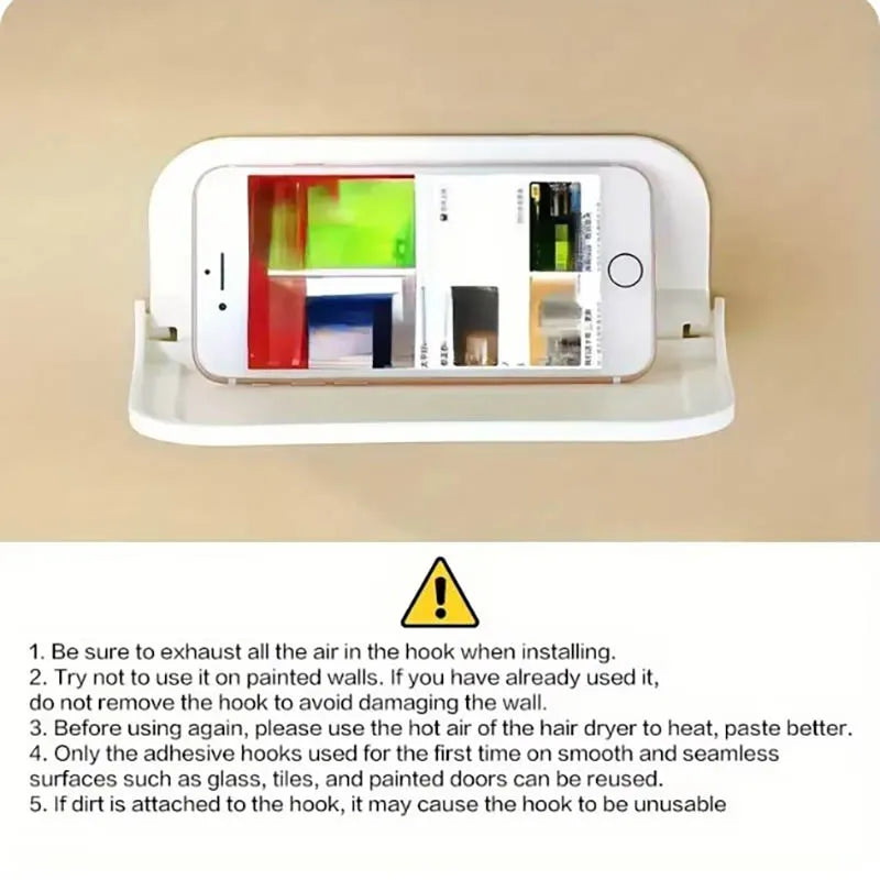 A white foldable no-drill wall shelf designed to hold various items like phones, routers, and toiletries.