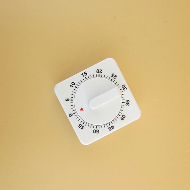 A white dial or gauge with a red indicator pointing near the 10 mark on a light beige background.