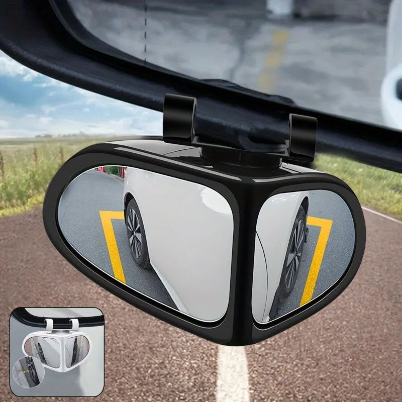 A close-up view of a black blind spot mirror mounted on a car door, showing a reflection of the vehicle and road.