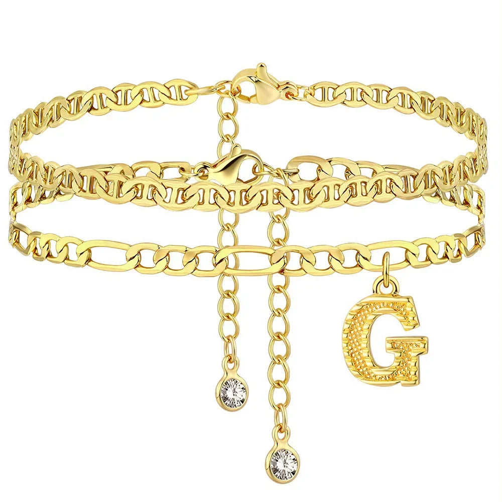 Gold stainless steel initial anklet featuring a chain bracelet and a large letter G charm