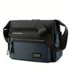 Black and navy blue men's water-resistant nylon crossbody sling bag with adjustable strap