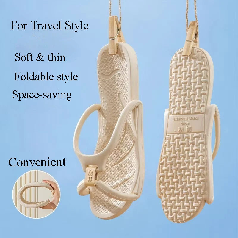 Pair of light beige foldable EVA travel slippers with a strap, shown hanging.