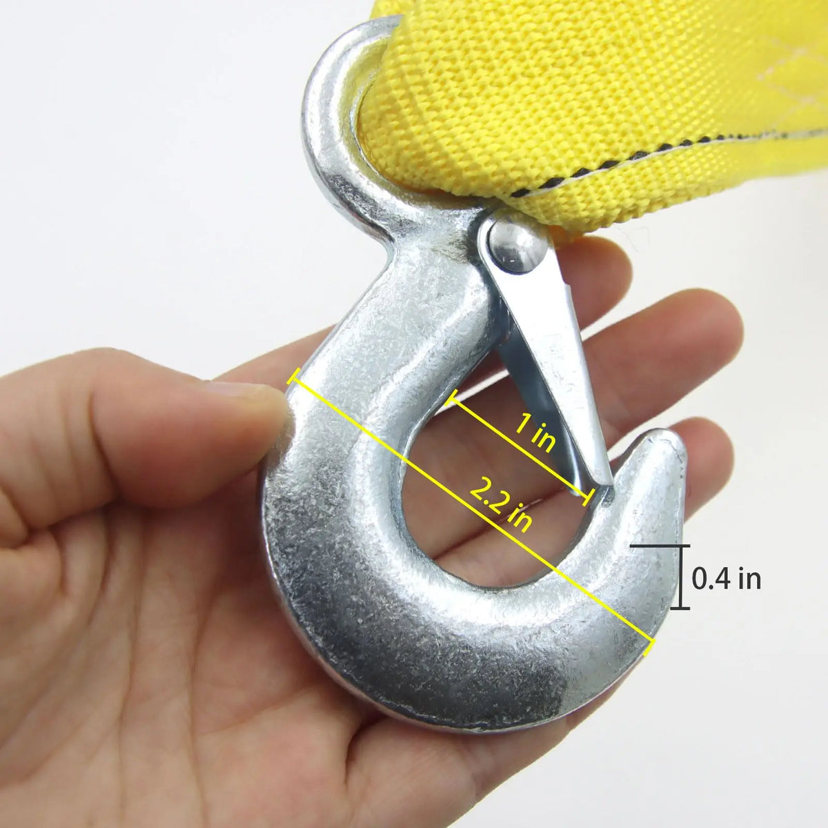 A hand holds a silver heavy-duty vehicle recovery towing strap with marked dimensions.