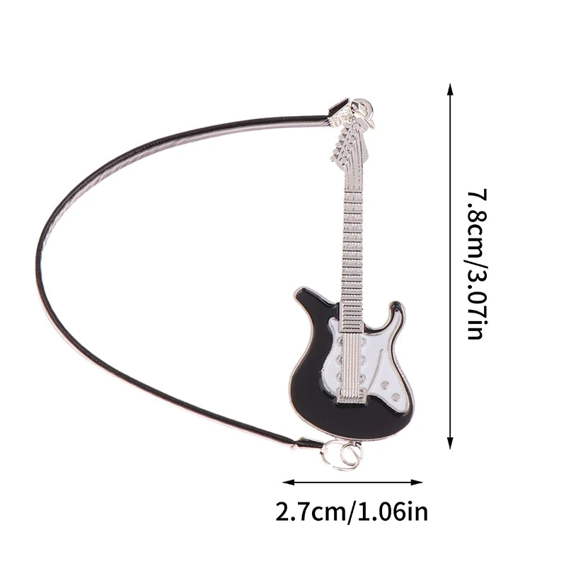 A black electric guitar miniature with a neck and body, shown against a white background.