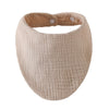 A beige organic cotton muslin baby bib with an absorbent band around the neck.