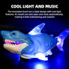 A blue shark toy with cool light features is shown against a dark background.