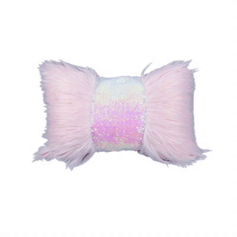 A pink faux fur cushion cover with a silver and gold sequin decorative band.