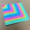 A colorful 12x12 multiplication practice math game board with numbered tiles for times table learning.