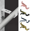 Various metal curtain rod brackets in pink, gold, and blue colors mounted on a white wall.