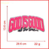 Pink embroidered patch with the text God Is Good all the time on a white background