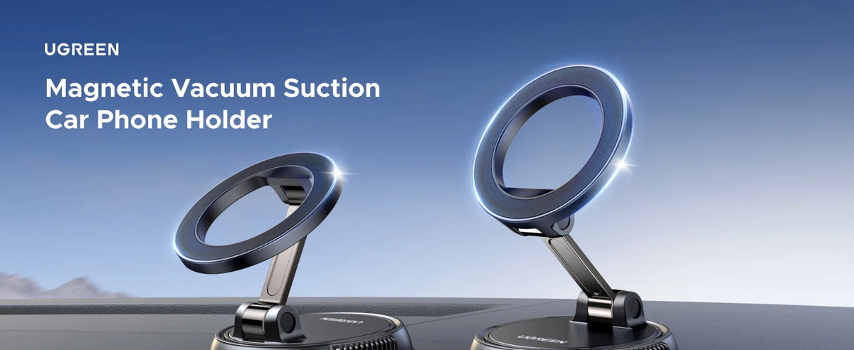 A silver magnetic vacuum suction phone holder mounted on a dashboard surface.