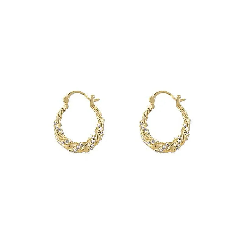 Pair of gold finish twisted zircon hoop earrings