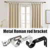 A set of metal Roman rod brackets for curtain rods shown against a window backdrop.