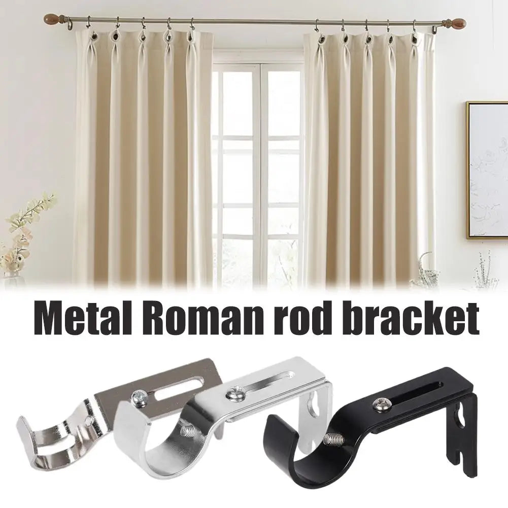 A set of metal Roman rod brackets for curtain rods shown against a window backdrop.