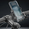 A clear phone mount is attached to a bicycle handlebar, demonstrating its use for mounting a smartphone.