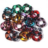 A collection of colorful acrylic spacer beads in wave patterns, including green, purple, and red shades.
