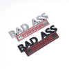A set of three 3D metal chrome badge emblems with the text BAD ASS EDITION on a black and silver background.
