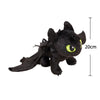A black soft plush dragon toy with authentic Night Fury features and bright lime green eyes.