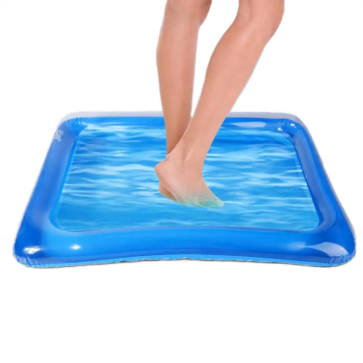 A person's feet are soaking in a blue inflatable foot soaking basin.
