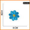 A single blue flower patch with a yellow center, used for embroidery or iron-on applications.