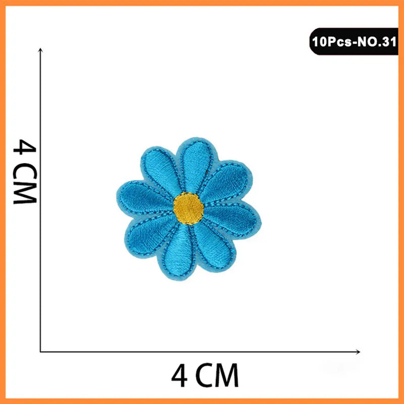 A single blue flower patch with a yellow center, used for embroidery or iron-on applications.