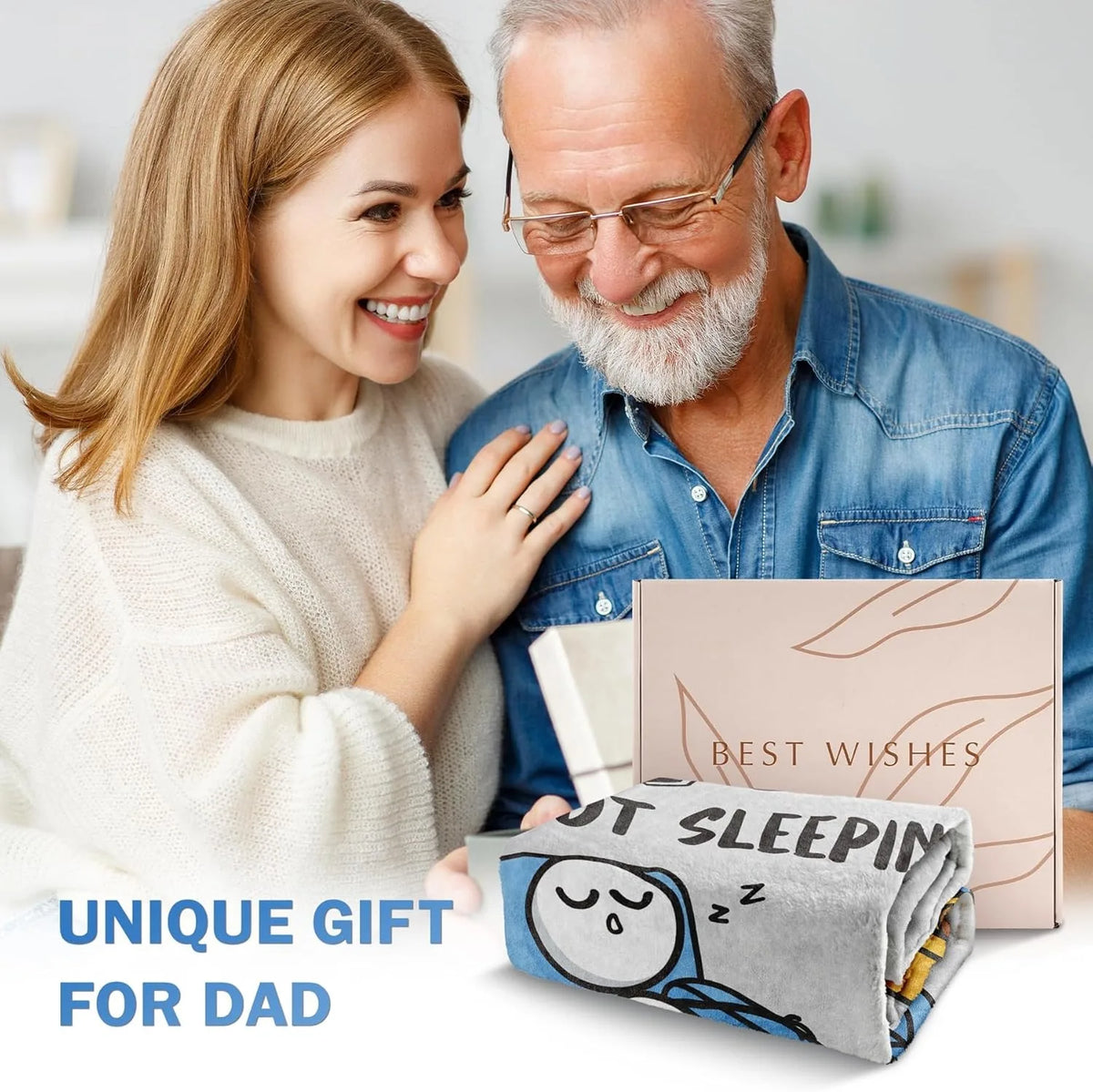 A man and woman smiling while holding a personalized printed fleece throw blanket for dad