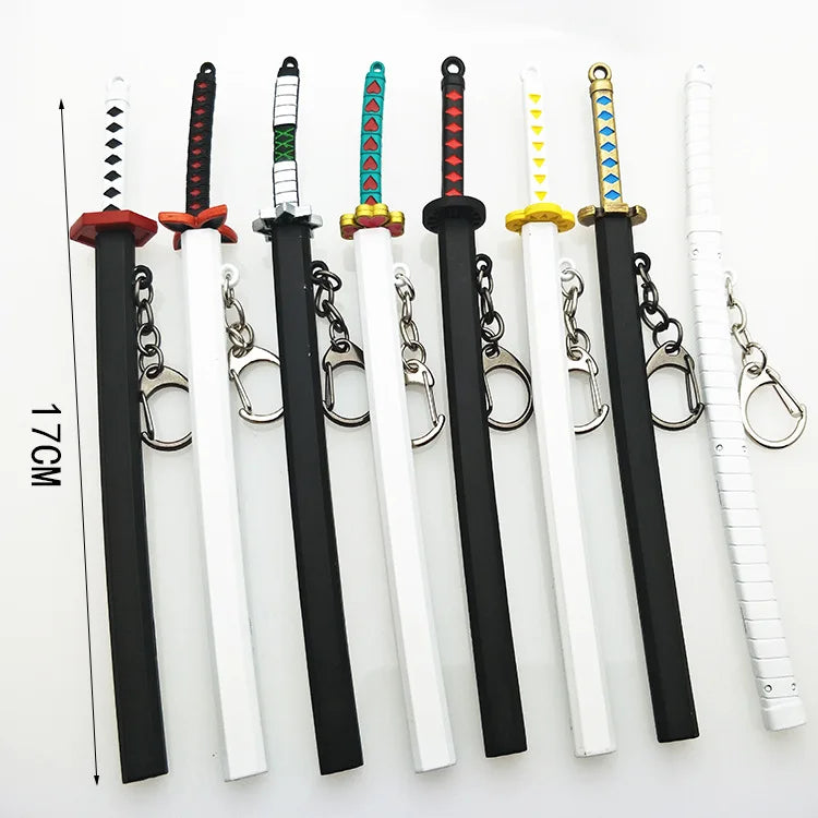 A collection of miniature metal katana replicas featuring various colored hilts and blades.