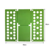 A green plastic clothes folding board with multiple holes for hanging shirts and t-shirts.