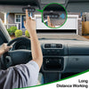 A hand is shown pressing a button on a garage door remote device installed in a car, demonstrating long distance working.