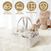 A beige corduroy baby diaper caddy organizer with handles is shown on a white fluffy rug next to a teddy bear.