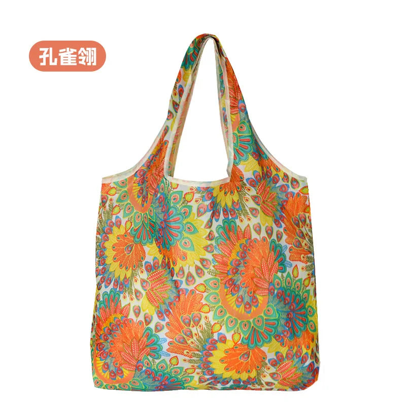 A colorful, floral patterned reusable nylon shopping tote bag.