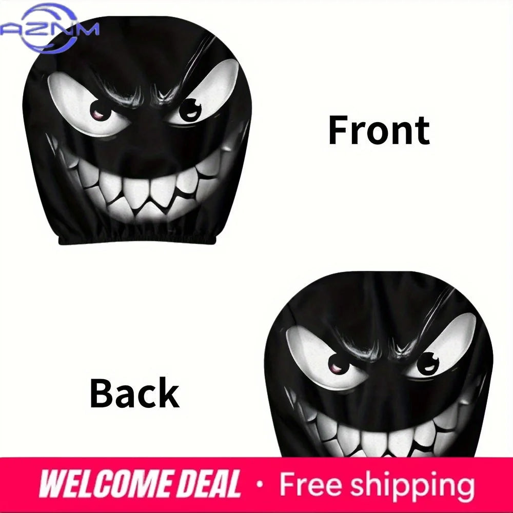 A pair of black evil grin car headrest covers, showing the front and back views.