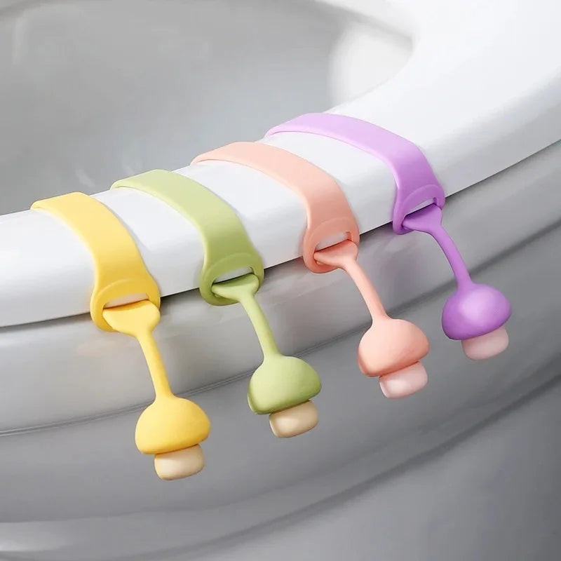 A set of colorful silicone toilet seat lifters with pull rings in pastel shades.