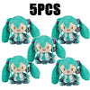 Five soft teal Hatsune Miku plush dolls in various poses.