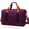 A purple large capacity water-resistant travel duffle bag with brown handles and black accents.