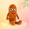 A brown plush toy shaped like a shark with large eyes and a smiling face.