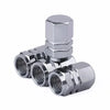 A set of four shiny silver aluminum alloy wheel tire valve caps with a hexagon design.