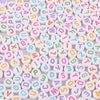 A collection of white and colored acrylic alphabet letter beads for jewelry making