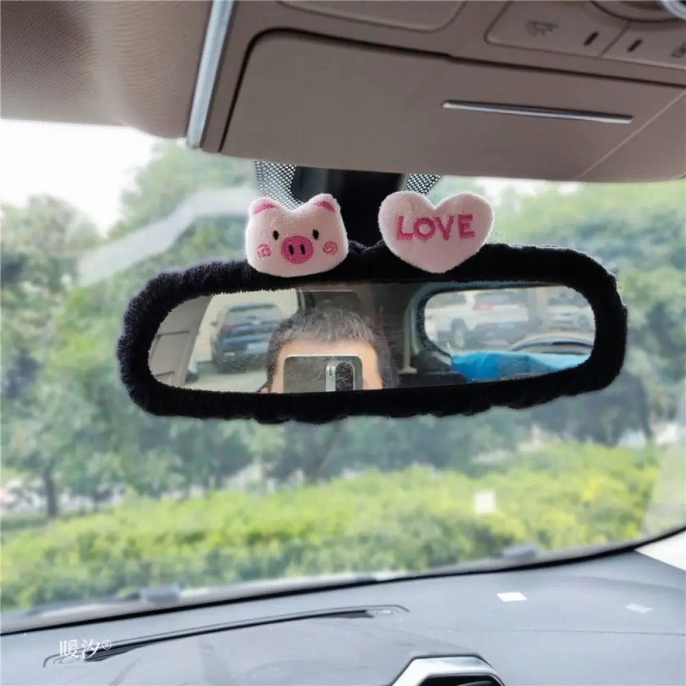 Car rearview mirror covers decorated with pink plush bear and heart shapes