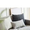 A set of striped velvet corduroy cushion covers on a gray sofa with a framed picture.